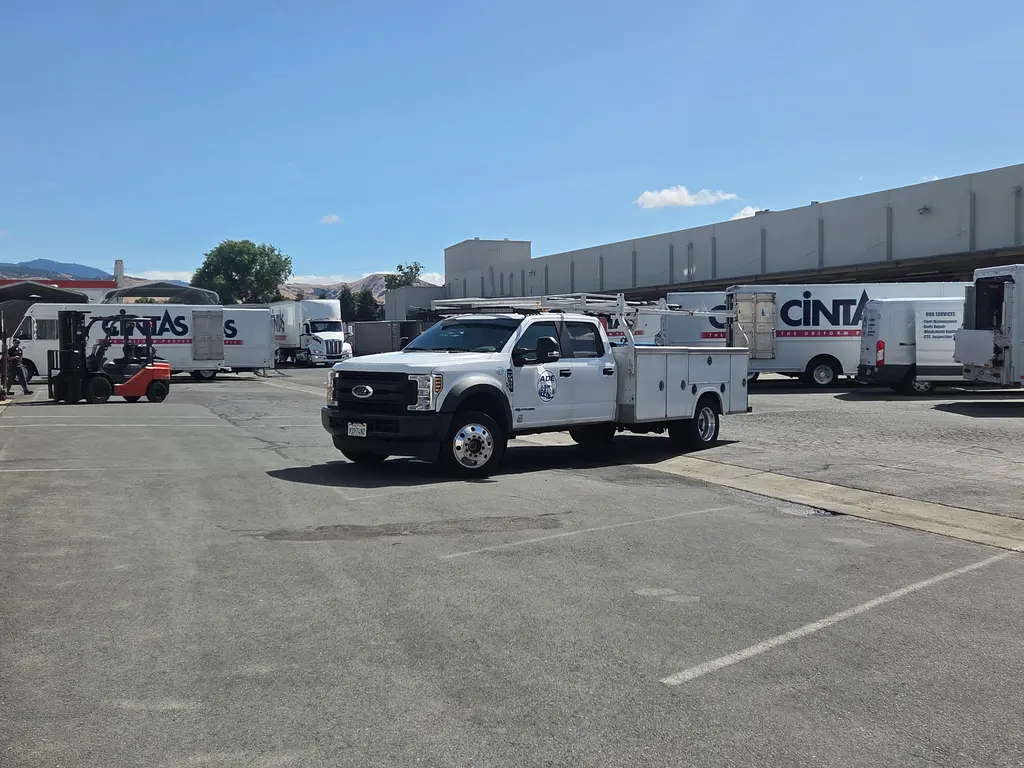 ADE service truck parked in a commercial fleet lot