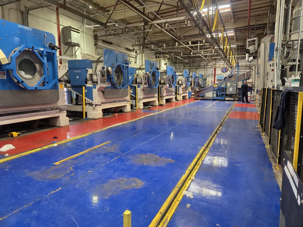 Industrial plant floor with heavy machinery lines where equipment is serviced