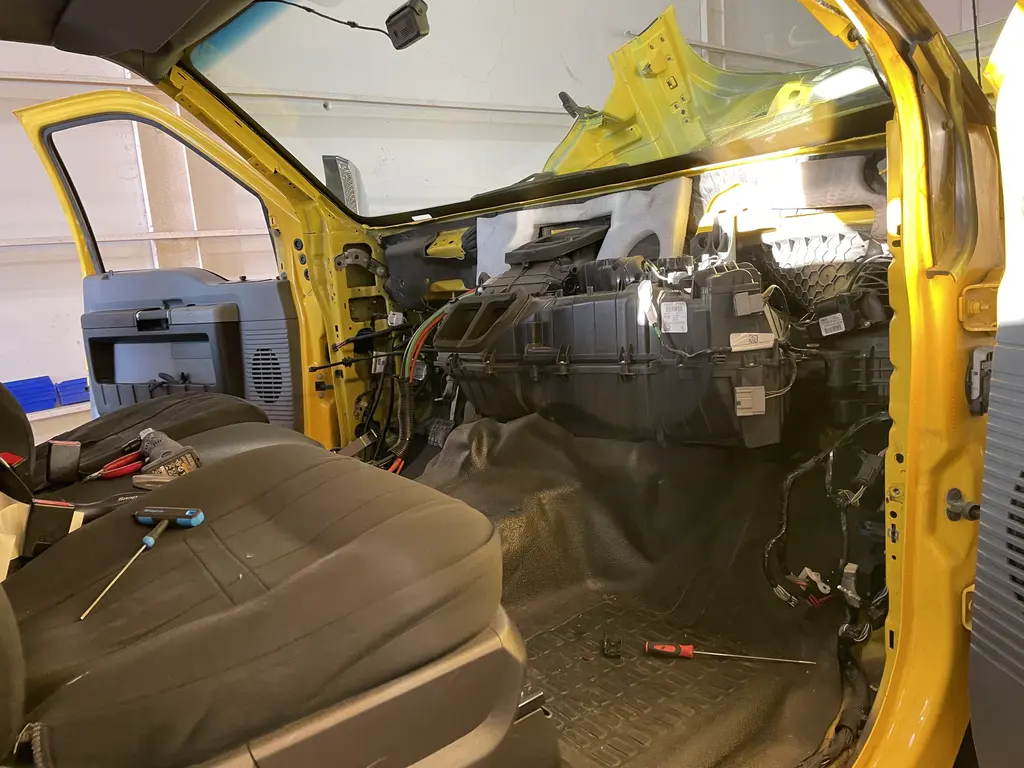 Truck cab with the dash taken apart for electrical and climate system repair